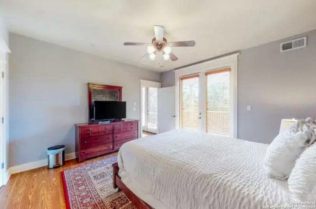 bedroom with access to exterior, french doors, light hardwood / wood-style floors, and ceiling fan