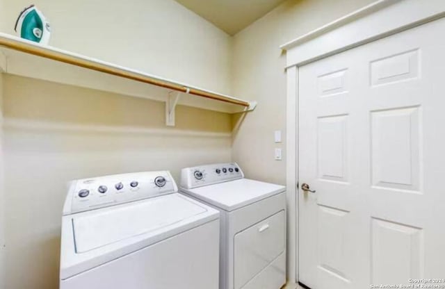 clothes washing area featuring washing machine and clothes dryer