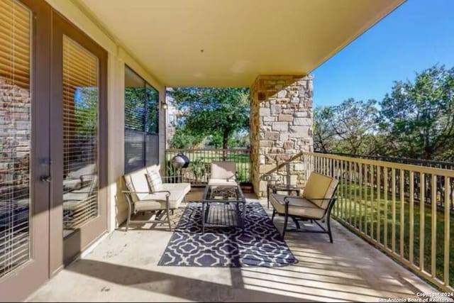 balcony featuring french doors