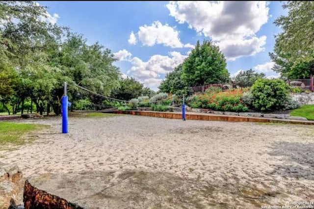 surrounding community featuring volleyball court