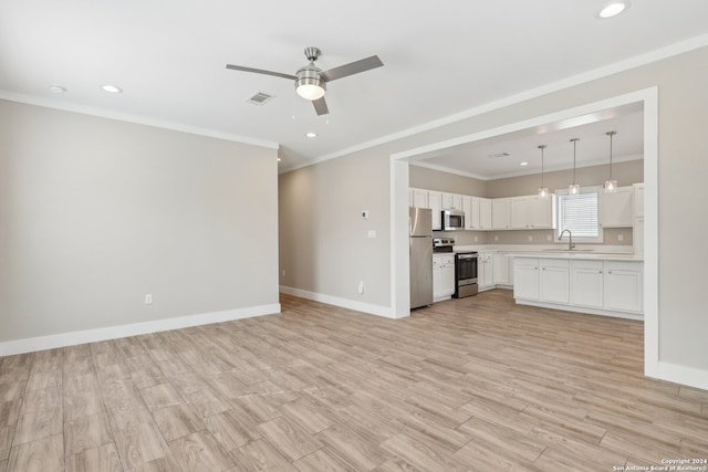 unfurnished living room featuring sink, ornamental molding, and light hardwood / wood-style flooring