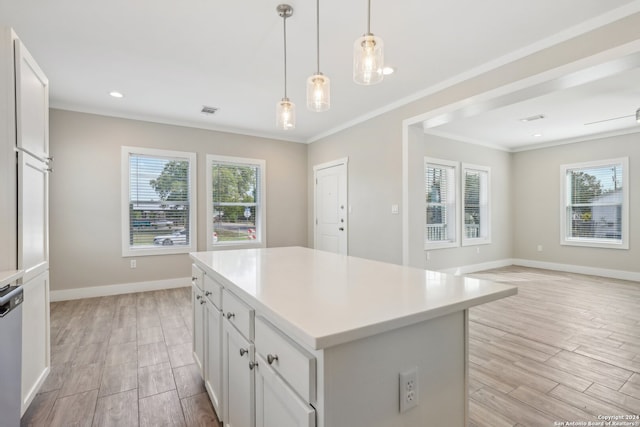 kitchen featuring white cabinets, light hardwood / wood-style floors, and a kitchen island