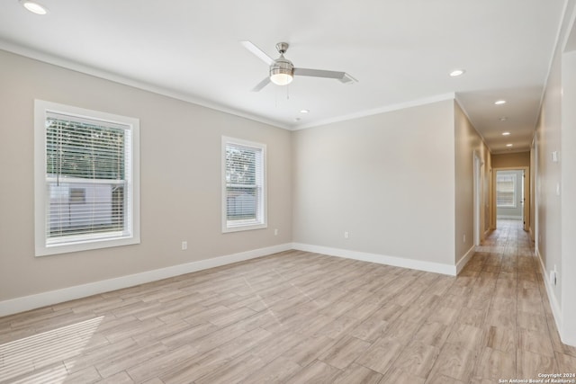 unfurnished room featuring light hardwood / wood-style flooring, ceiling fan, and crown molding