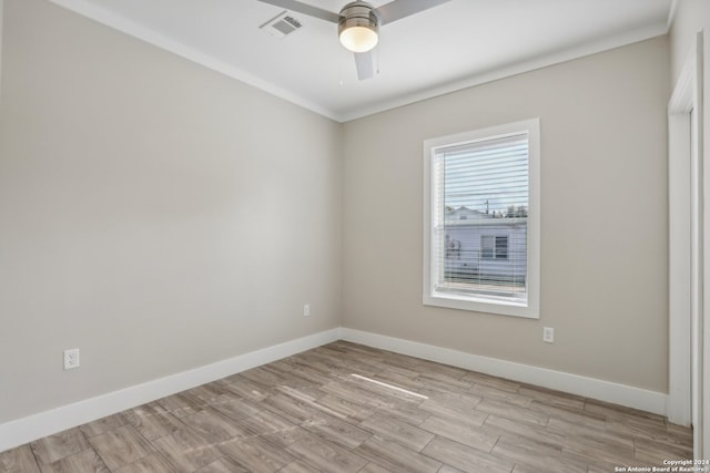 empty room with light hardwood / wood-style flooring, ceiling fan, and ornamental molding