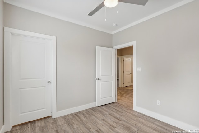 unfurnished bedroom with ceiling fan and light hardwood / wood-style flooring