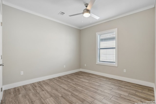 spare room featuring crown molding, ceiling fan, and light wood-type flooring