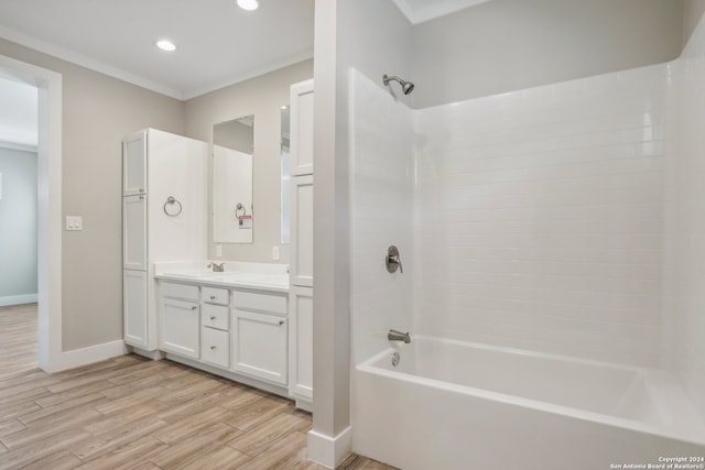 bathroom featuring hardwood / wood-style floors, vanity, and bathtub / shower combination