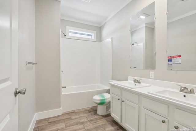 bathroom featuring hardwood / wood-style floors, vanity, and tub / shower combination