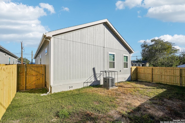 rear view of property with a lawn