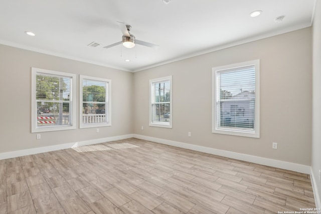 unfurnished room featuring light hardwood / wood-style floors, ceiling fan, and crown molding