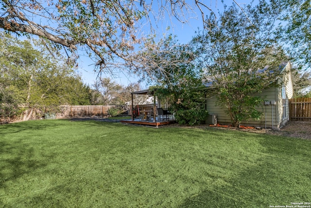 view of yard with a wooden deck