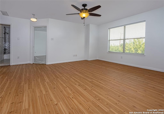 spare room with ceiling fan and light hardwood / wood-style floors