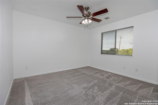 spare room with carpet flooring and ceiling fan