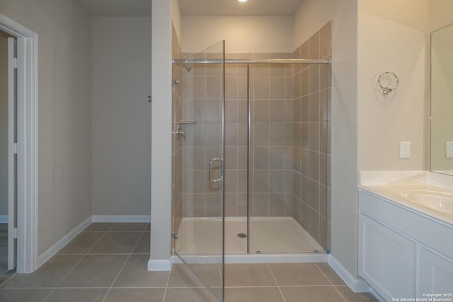6727 Tasajillo Spg, San Antonio, TX 78253 - bathroom featuring tile patterned floors, a stall shower, vanity, and baseboards
