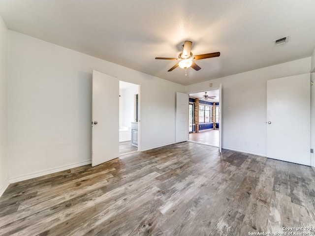 spare room featuring ceiling fan and hardwood / wood-style flooring