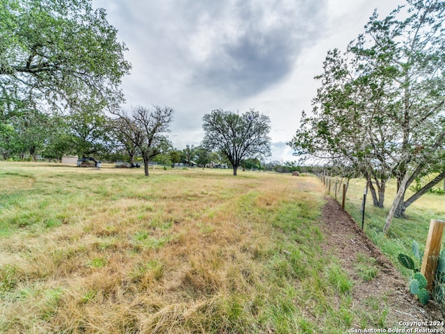 view of yard with a rural view