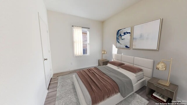 bedroom featuring light wood-type flooring