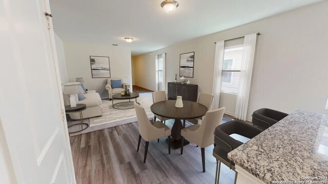 dining room with hardwood / wood-style floors