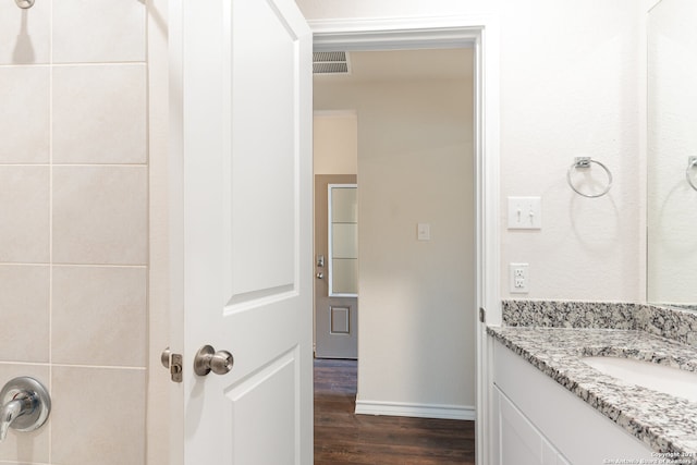 bathroom featuring vanity and wood-type flooring