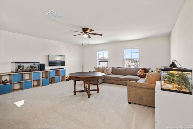 carpeted living room featuring ceiling fan