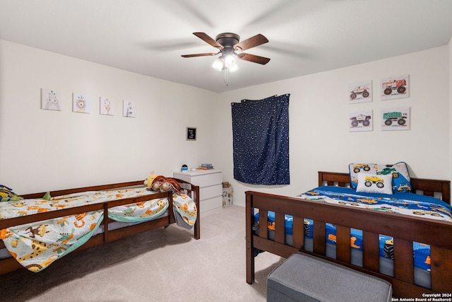 carpeted bedroom featuring ceiling fan