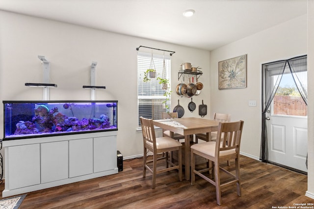 dining space with dark wood-type flooring