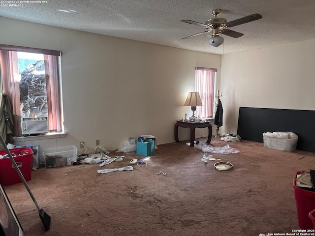 interior space with ceiling fan and a textured ceiling