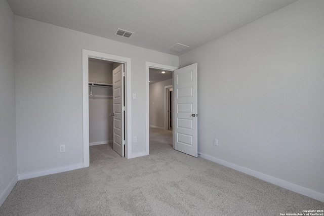 4750 Sahara Vlys, San Antonio, TX 78222 - unfurnished bedroom featuring carpet, a spacious closet, baseboards, and a closet