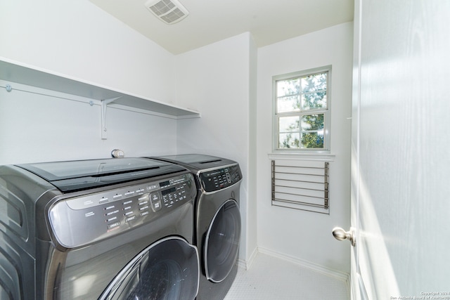 laundry area featuring tile patterned flooring and independent washer and dryer