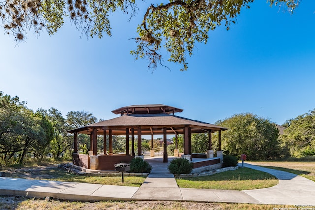 surrounding community with a gazebo and a lawn