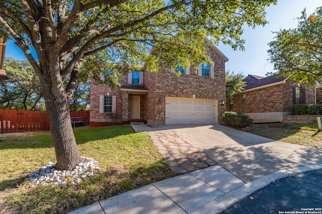 view of front of home with a front lawn and a garage