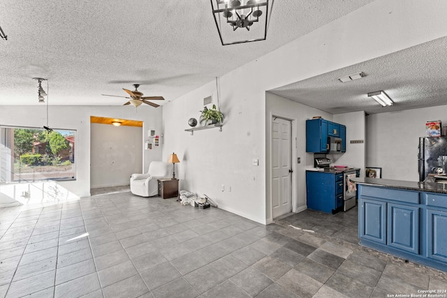 interior space with a textured ceiling, tile patterned floors, ceiling fan with notable chandelier, and lofted ceiling