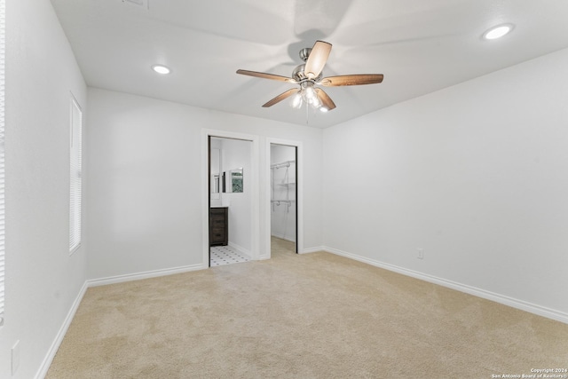 611 Kirk Pl, San Antonio, TX 78225 - unfurnished bedroom featuring light carpet, baseboards, recessed lighting, a walk in closet, and a ceiling fan