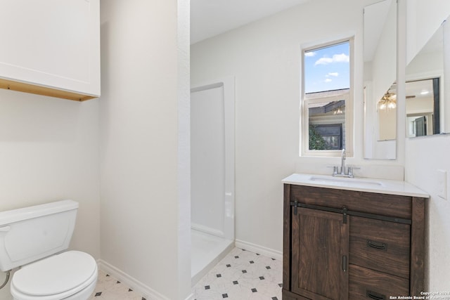 611 Kirk Pl, San Antonio, TX 78225 - bathroom featuring toilet, vanity, and baseboards