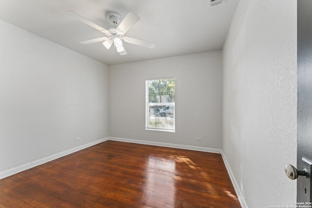 611 Kirk Pl, San Antonio, TX 78225 - empty room with wood finished floors, ceiling fan, and baseboards