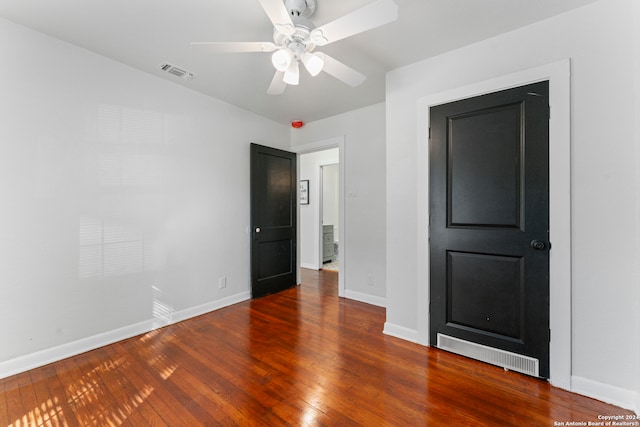 unfurnished bedroom with wood-type flooring and ceiling fan