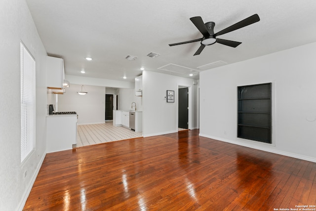 unfurnished living room with ceiling fan and light hardwood / wood-style floors