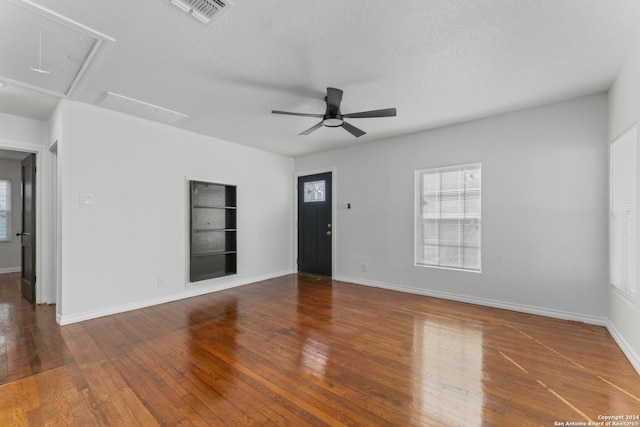 611 Kirk Pl, San Antonio, TX 78225 - unfurnished living room featuring attic access, a ceiling fan, plenty of natural light, and wood finished floors