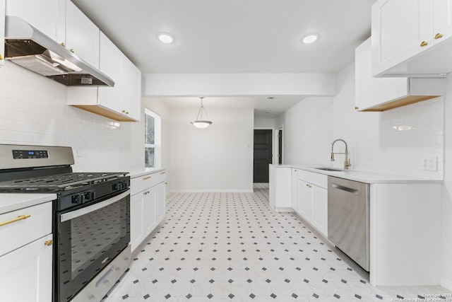 611 Kirk Pl, San Antonio, TX 78225 - kitchen featuring appliances with stainless steel finishes, under cabinet range hood, light countertops, light floors, and recessed lighting