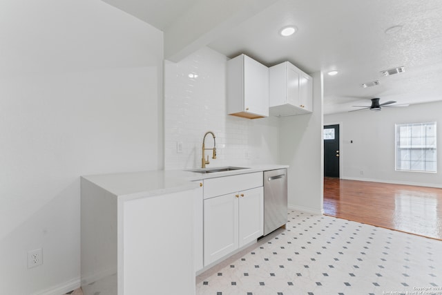 kitchen with white cabinetry, dishwasher, sink, and ceiling fan