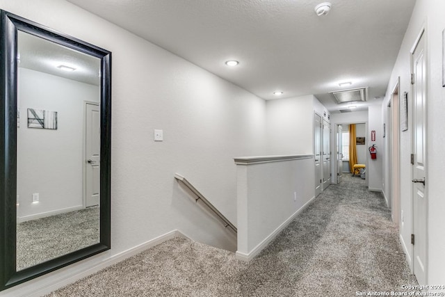 7544 Magnolia Vlg, San Antonio, TX 78252 - hall featuring carpet flooring, an upstairs landing, and baseboards