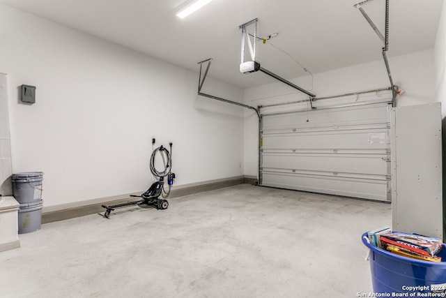 garage featuring a garage door opener