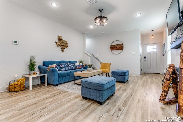 7544 Magnolia Vlg, San Antonio, TX 78252 - living room featuring light wood-style flooring, baseboards, and recessed lighting