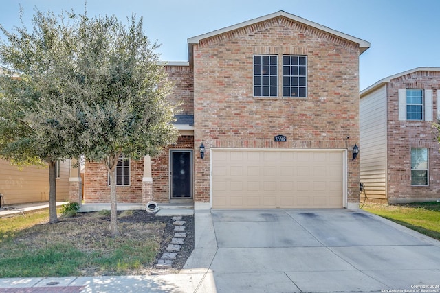 11902 Silver Horse, San Antonio, TX 78254 - view of front of home with brick siding, an attached garage, and driveway