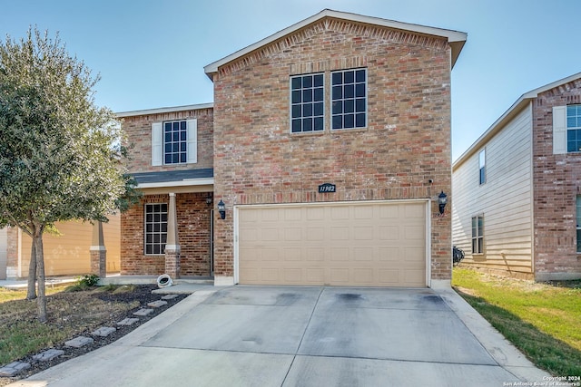 11902 Silver Horse, San Antonio, TX 78254 - view of front of property with a garage, brick siding, and driveway