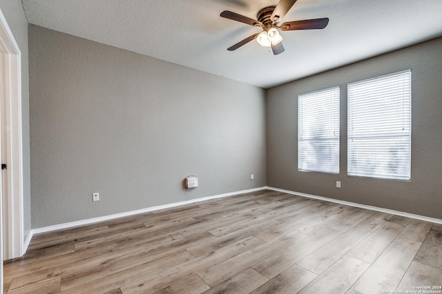 11902 Silver Horse, San Antonio, TX 78254 - unfurnished room featuring ceiling fan, wood finished floors, and baseboards