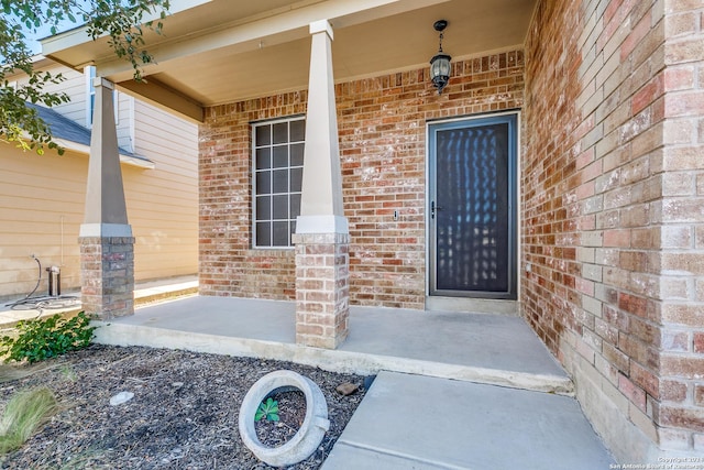 11902 Silver Horse, San Antonio, TX 78254 - view of exterior entry with brick siding and covered porch