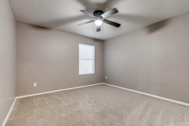 11902 Silver Horse, San Antonio, TX 78254 - unfurnished room featuring a ceiling fan, carpet, baseboards, and a textured ceiling