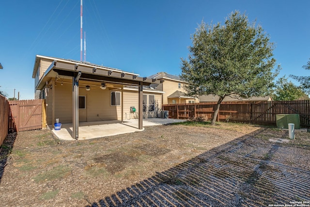 11902 Silver Horse, San Antonio, TX 78254 - rear view of house featuring a patio, a fenced backyard, a ceiling fan, and a gate