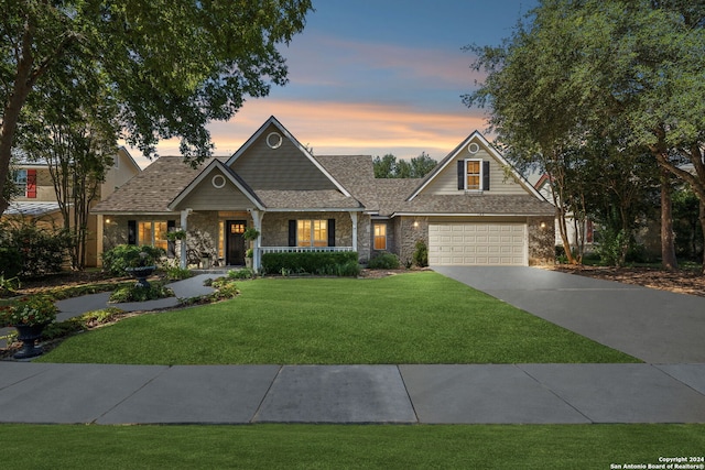 craftsman house with a lawn and covered porch